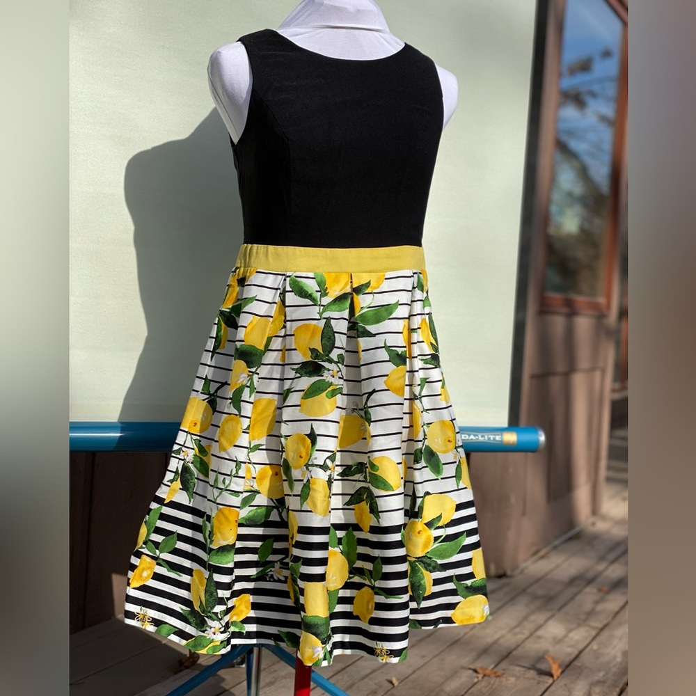 Lemon-print sleeveless dress. Black, fully-lined bodice. Size 8